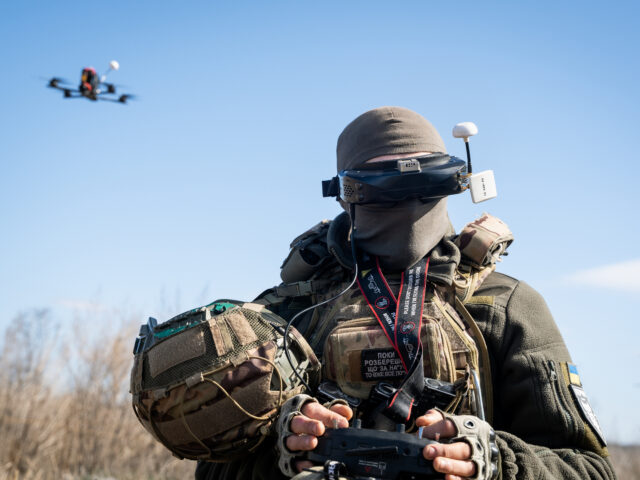 A Ukrainian soldier performs a trial with an FPV drone in the region of Kharkiv, Ukraine,