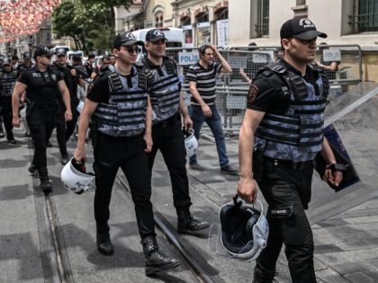 Turkish anti riot police officers arrive to block and surround Taksim square and Istiklal