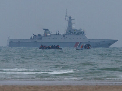 GRAVELINES, FRANCE - JULY 02: A Maritime Gendarmerie rib approaches a small boat full of m