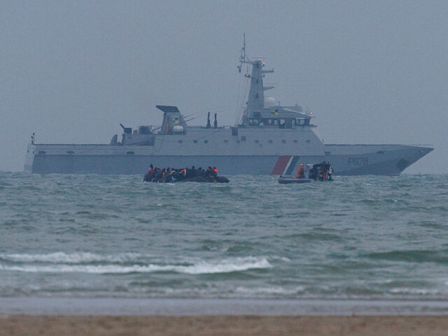 GRAVELINES, FRANCE - JULY 02: A Maritime Gendarmerie rib approaches a small boat full of m