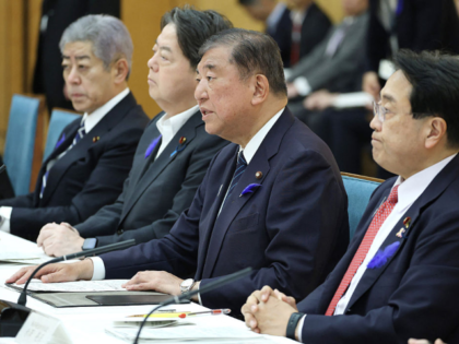Japan's Prime Minister Shigeru Ishiba (2nd R) speaks at the headquarters for comprehensive