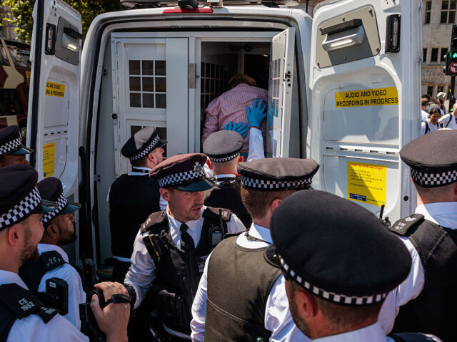 Protest Against The Proscription Of Palestine Action London Metropolitan Police officers arrest a protester who had held a sign reading 'I Oppose
