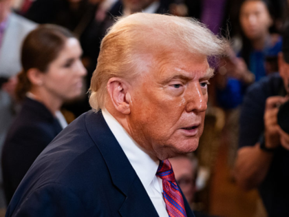 WASHINGTON, DC - JULY 18: President Donald Trump exits after signing the GENIUS Act at the