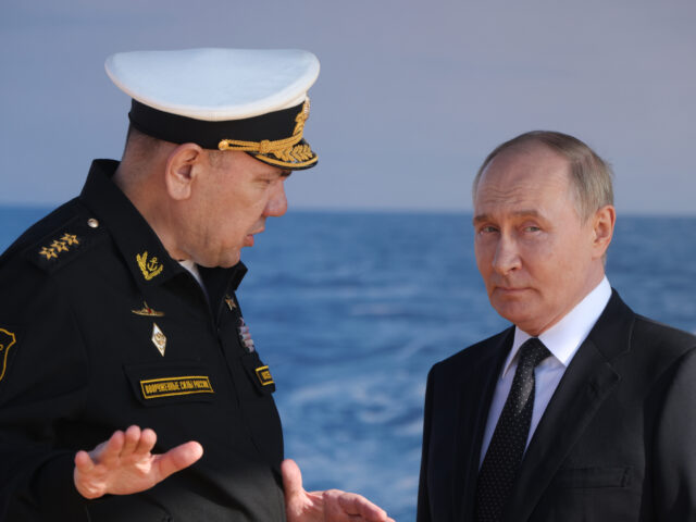 SEVEDOVDINSK, RUSSIA - JULY 24: (RUSSIA OUT) Russian President Vladimir Putin (R) listens