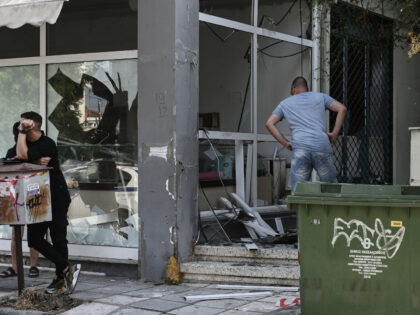 A man looks at a damaged shop following a strong blast in Thessaloniki on July 26, 2025. A