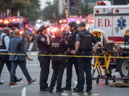 New York Police Department (NYPD) officers respond to the scene of a shooting at 345 Park