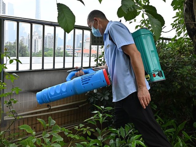 GettyImages-2227659673 GUANGZHOU, CHINA - JULY 30: A staff member carries out mosquito eradication work on a roof