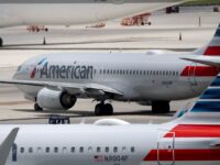 WATCH: ‘Panicking’ Travelers Exit American Airlines Plane Via Slides Due to Fire at Den