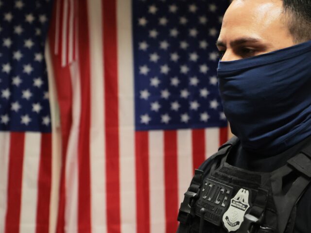 NEW YORK, NEW YORK - JULY 21: Federal agents patrol the halls of immigration court at the