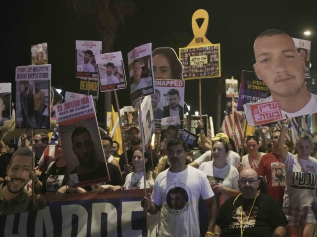 People take part in a protest outside US Embassy Branch demanding the end of the war and i
