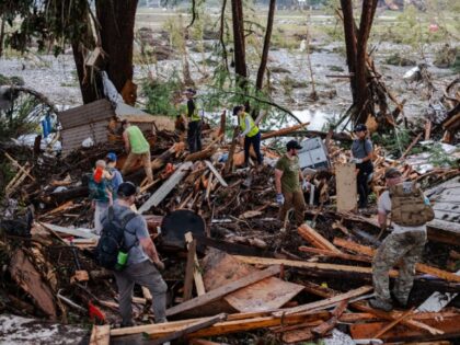 HUNT, TEXAS - JULY 6: Search and rescue workers dig through debris looking for any survivo