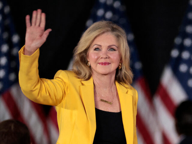 US Sen. Marsha Blackburn (R-TN) waves as she arrives for a town hall with former US Presid