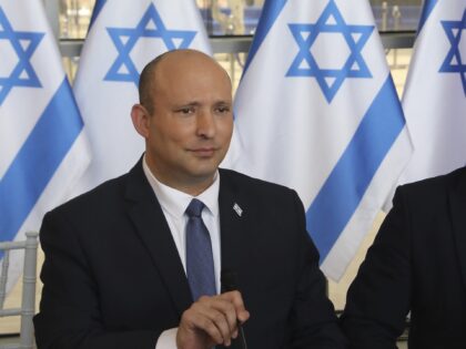 Israeli Prime Minister Naftali Bennet, left, chairs a weekly cabinet meeting in Jerusalem,