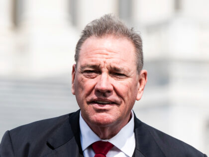 Rep. Neal Dunn, R-Fla., speaks during a television news interview before voting on the rul