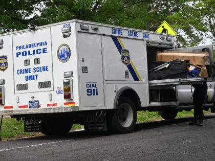 The Philadelphia Police Crime Scene Unit along with federal agents stage at the scene, sea