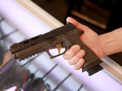 A Sig Sauer P320 handgun is held at the WEX Gunworks store on January 31, 2023 in Delray B