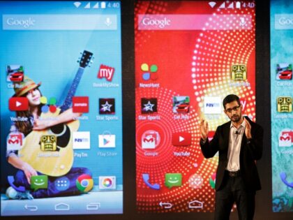 Sundar Pichai in front of Google Android phones