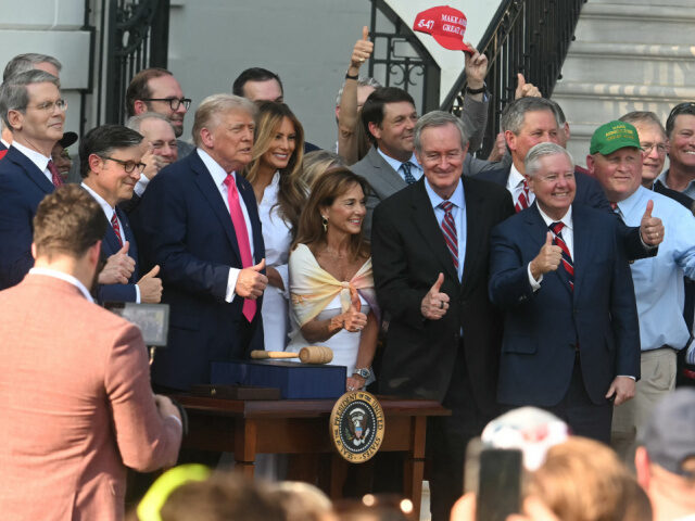 Trump Bill Signing OBBB US President Donald Trump surrounded by members of his cabinet and and First Lady Melania