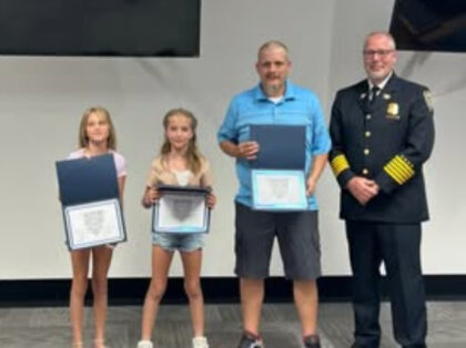 Twin girls, maintenance man honored