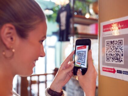 Woman scanning a QR Code