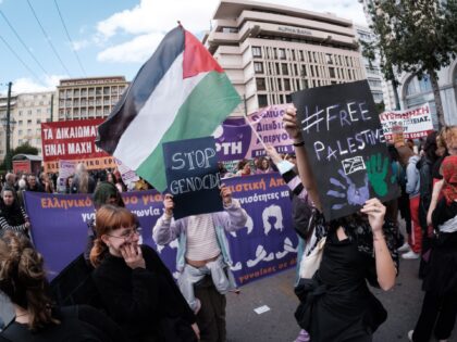 Students and feminist activists are holding Palestinian flags in support of Palestinian wo