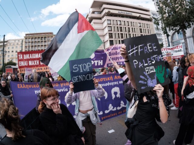 Students and feminist activists are holding Palestinian flags in support of Palestinian wo