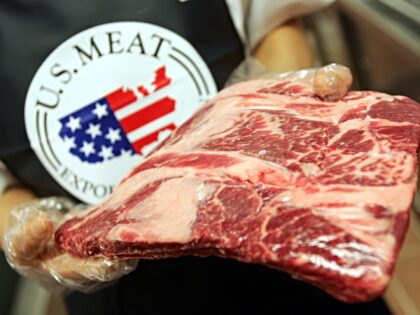 SEOUL, SOUTH KOREA - JULY 13: An employee prepares imported U.S. beef at a store on July 1