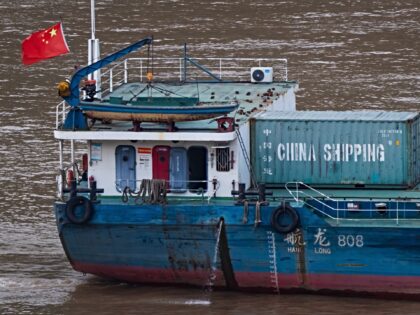 CHONGQING, CHINA - JULY 17: A Chinese cargo vessel carrying a China Shipping container and