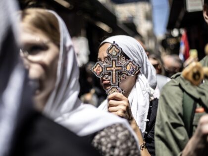 JERUSALEM - APRIL 18: Christians coming from around the world carrying wooden crosses marc