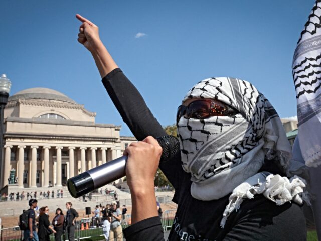 columbia university protest Pro-Palestinian demonstrators march through the Columbia University campus to mark one yea