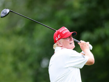 BEDMINSTER, NEW JERSEY - AUGUST 10: Former President Donald Trump follows his tee shot dur