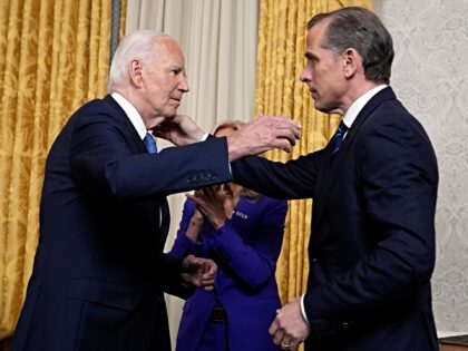 WASHINGTON, DC - JULY 24: U.S. President Joe Biden hugs son Hunter Biden after addressing