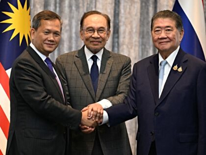 Malaysia's Prime Minister Anwar Ibrahim (C), Cambodia's Prime Minister Hun Manet (L) and T