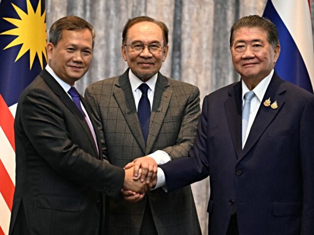 Malaysia's Prime Minister Anwar Ibrahim (C), Cambodia's Prime Minister Hun Manet (L) and T