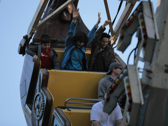 People On A Ride At An Amusement Park
