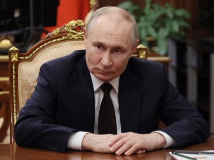 In this pool photograph distributed by the Russian state agency Sputnik, Russian President