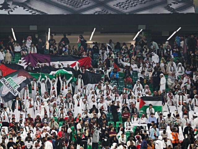 Fans are cheering during a charity football match, The Stand with Palestine, at the Educat