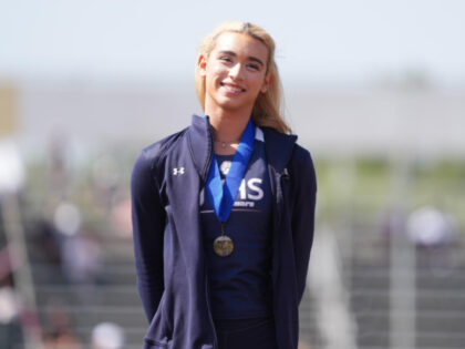 Transgender athlete AB Hernandez of Jurupa Valley poses with gold medal after winning the