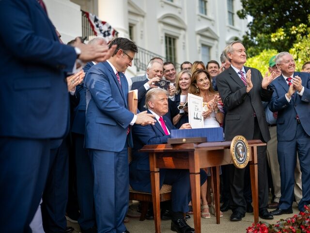 President Donald Trump signs the One Big Beautiful Bill Act on the South Lawn of the White
