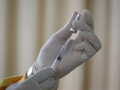 taking sinovac covid-19 vaccination injection