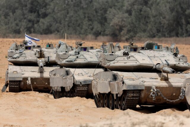 Israeli troops deploy at the border with the Gaza Strip on Tuesday, as the military announ