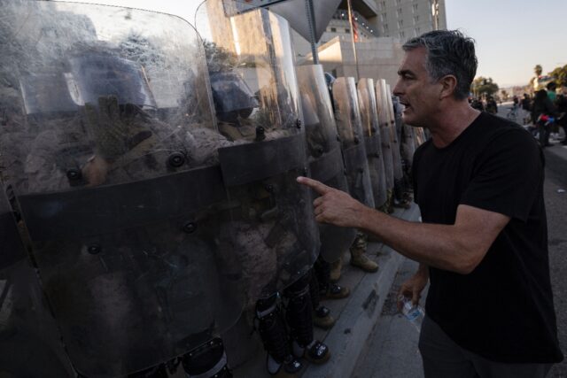 The National Guard troops have stood watch outside federal buildings in downtown Los Angel