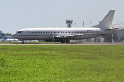 A plane taxis as it prepares to bring Venezuelan migrants home from a notorious prison in