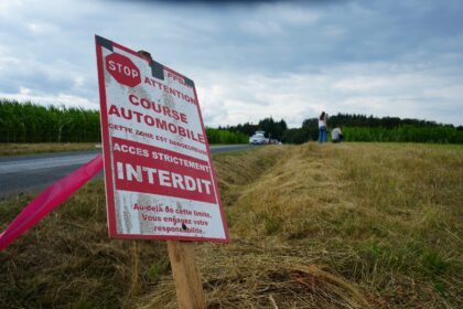 A sign prohibiting access is seen near the scene where three spectators were killed when a