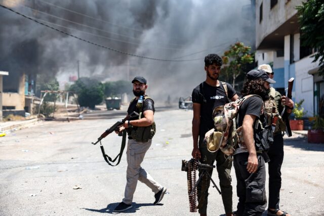 A thick pall of smoke rises over the Syrian city of Sweida as armed Bedouin and their alli