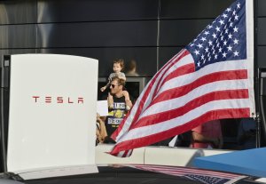 Tesla shares end week in decline amid third straight quarterly loss