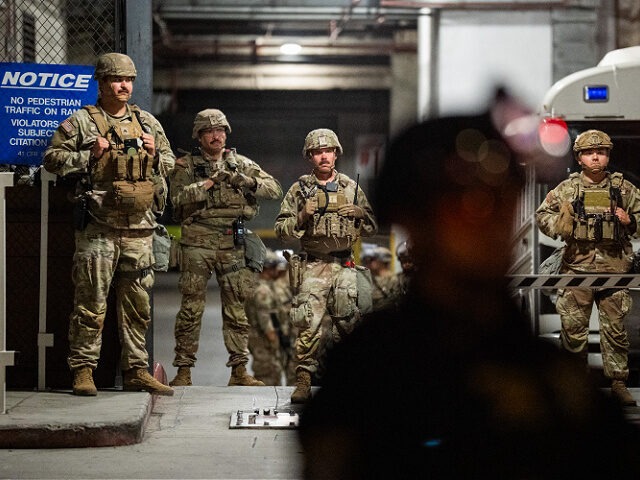 LOS ANGELES, CA - JULY 26: National Guard soldiers stand on duty in front of the federal M