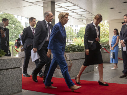 Swiss President Karin Keller-Sutter, center, arrives at the State Department, Wednesday, A
