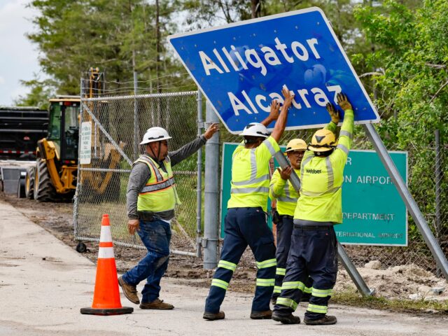 Alligator Alcatraz moves afoot Workers install a permanent Alligator Alcatraz sign. The facility is within the Florida Ev