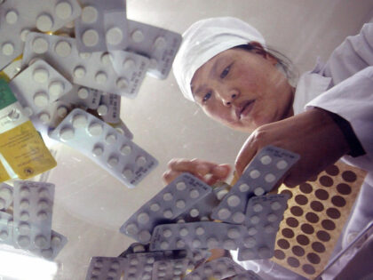 A worker at Guilin Pharmaceutical, one of only two Chinese companies converting what was f